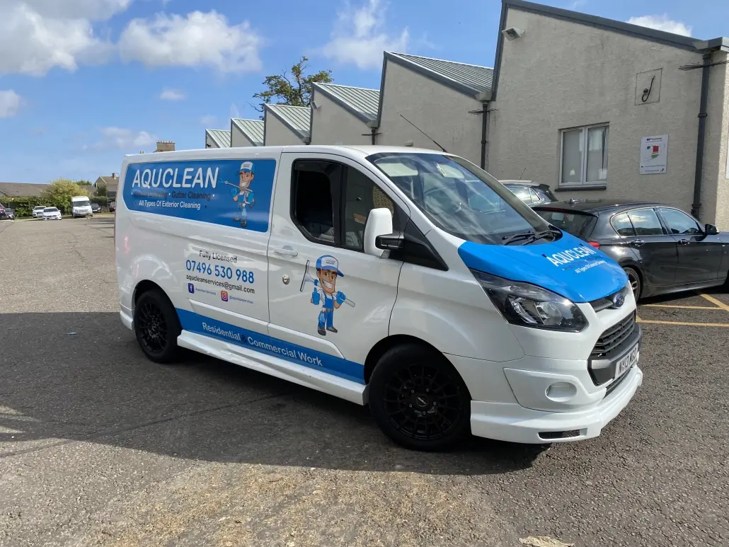 Aquclean van in blue and white livery with cut vinyl lettering and a printed character graphic